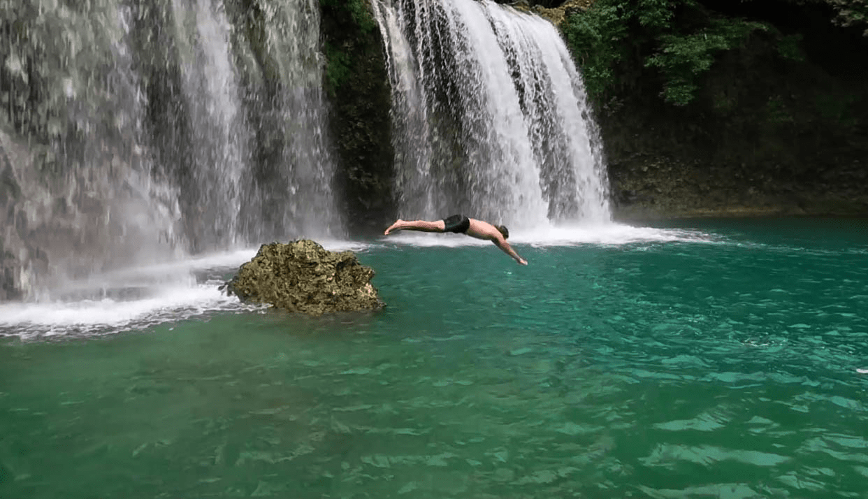 lenny through paradise diving in water at bolinao falls waterfall 1 in pangasinan province philippines